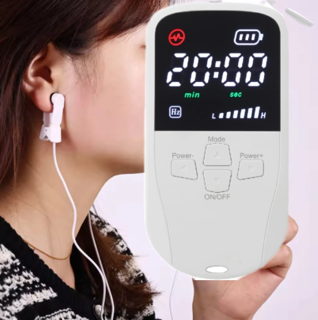 Woman using NeuroCalm with ear clips during a relaxation routine